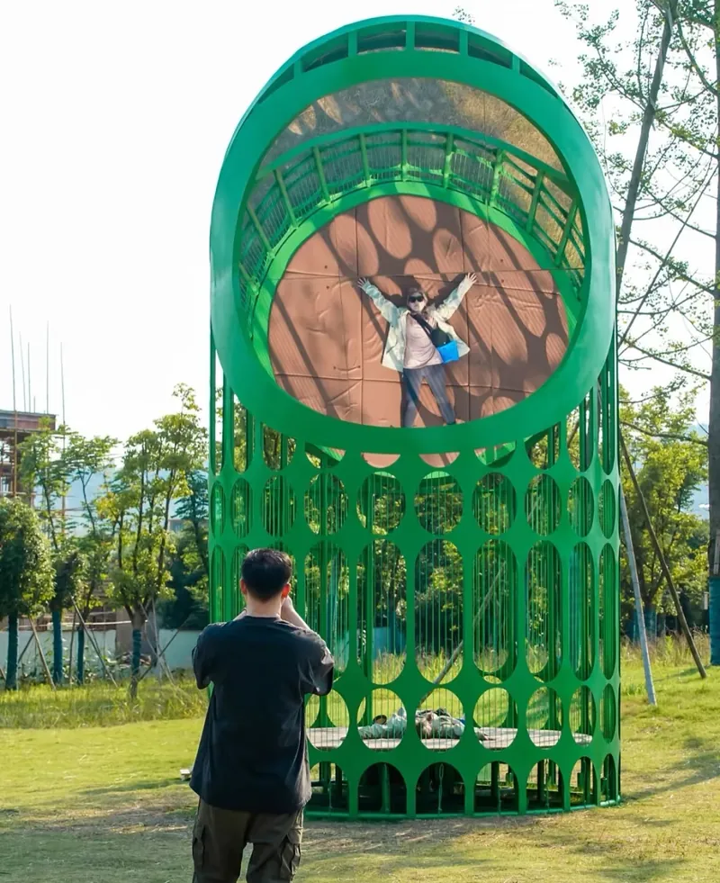 The green pod — Climb the pod from inside, rung by rung; put your head out and the wind is there.