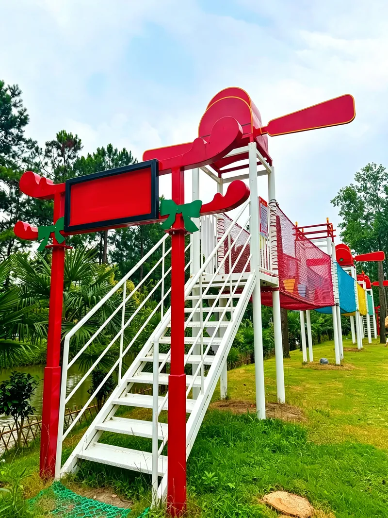 Propeller slide tower — Climb up to the propeller, then ride the long tube back to the ground.